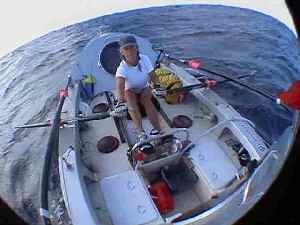 View of Roz Savage rowing in her boat Sedna Solo across the Atlantic
